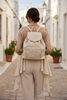 TRAVELLING. BEIGE LEATHER BACKPACK WITH 3D DETAILS