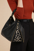 VENUSA. BLACK LEATHER BAG WITH ART SIDES