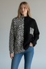 BLACK SOFT PULLOVER WITH ANINAL PRINT DETAILS