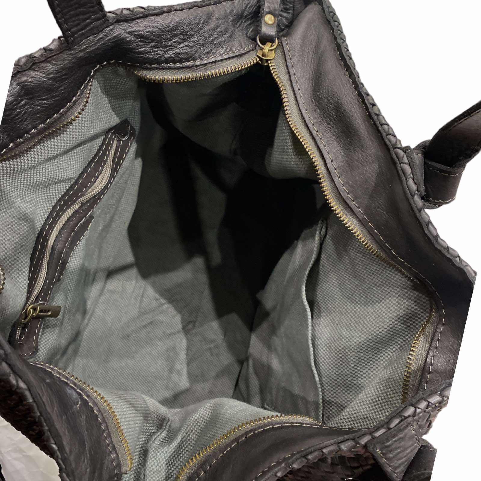 Black woven leather shoulder bag with front pocket