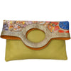 Circle flat. Art stones and yellow leather messenger bag