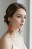 Long earrings with pink tassels