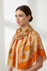 Orange scarf with gold art polka dots
