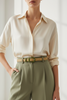 Beige leather thin belt with olive green details