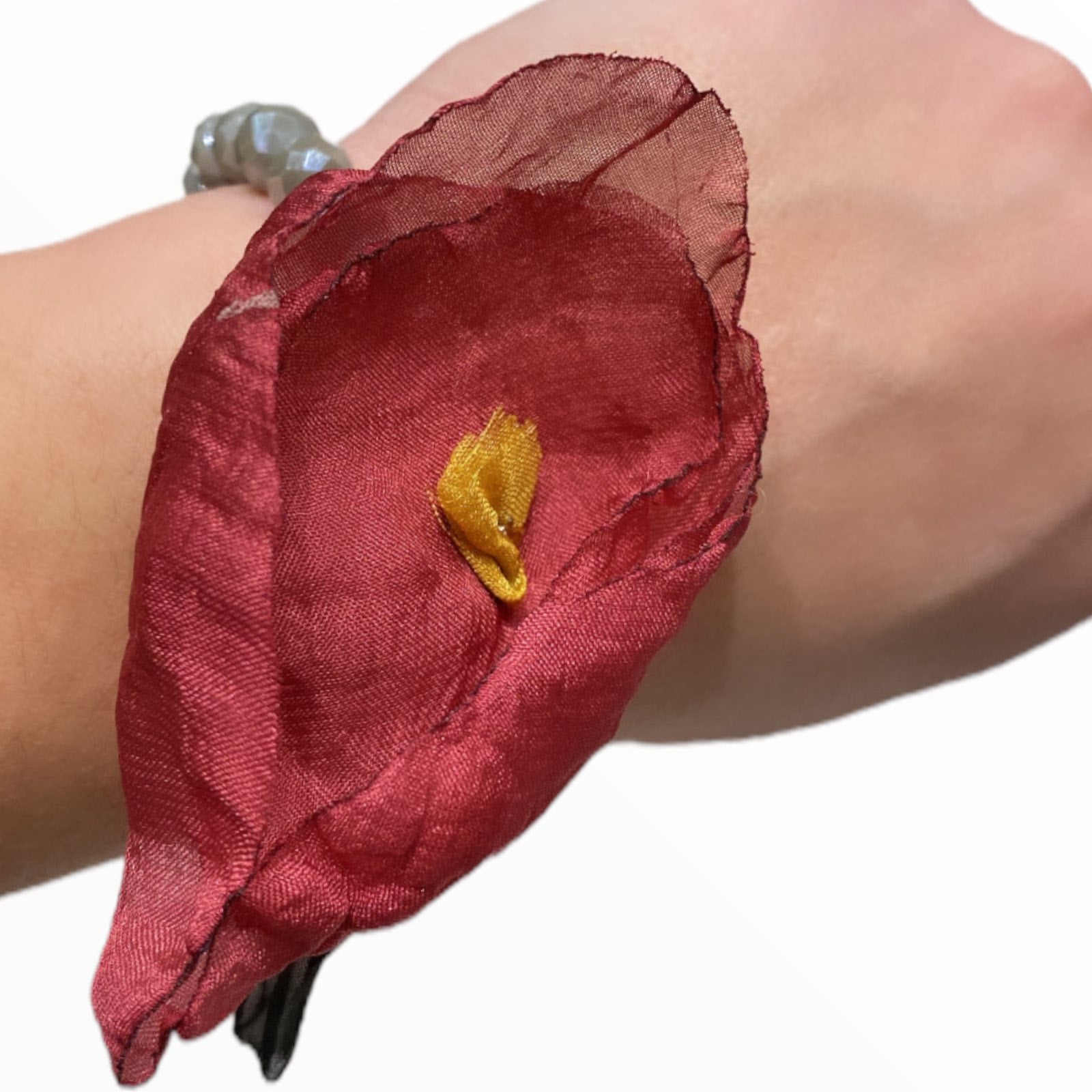Grey bracelet with red flower